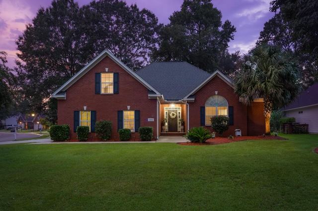 view of front of house with a lawn