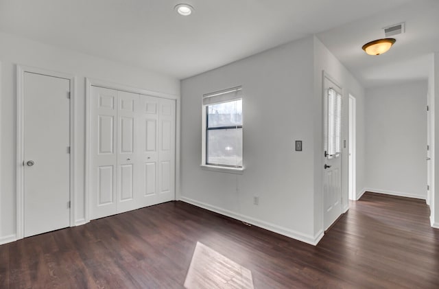 entrance foyer featuring dark hardwood / wood-style floors