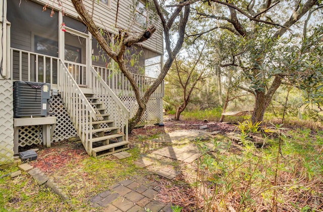 view of yard with a sunroom