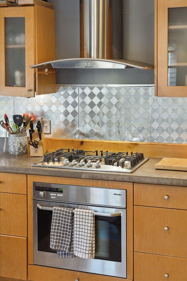 87 America St Unit A, B, C, Charleston, SC 29403 - kitchen with ventilation hood, appliances with stainless steel finishes, decorative backsplash, and glass insert cabinets