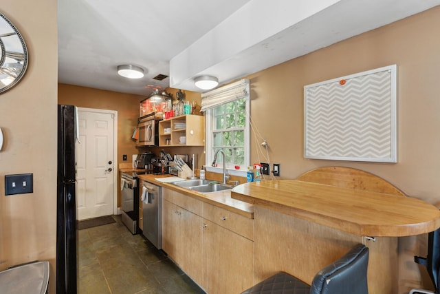 87 America St Unit A, B, C, Charleston, SC 29403 - kitchen featuring a sink, appliances with stainless steel finishes, butcher block counters, a kitchen bar, and light brown cabinets