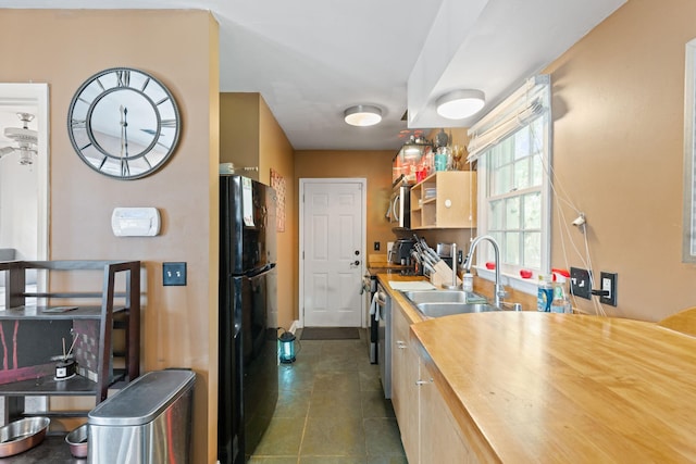 87 America St Unit A, B, C, Charleston, SC 29403 - kitchen featuring stainless steel appliances, a sink, butcher block countertops, and dark tile patterned floors