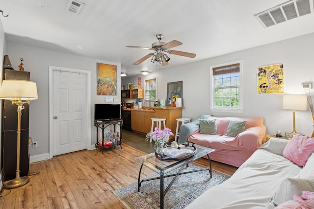 87 America St Unit A, B, C, Charleston, SC 29403 - living room featuring a ceiling fan, light wood finished floors, and baseboards