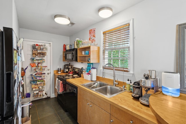 87 America St Unit A, B, C, Charleston, SC 29403 - kitchen with black appliances, a sink, dark tile patterned floors, wood counters, and open shelves