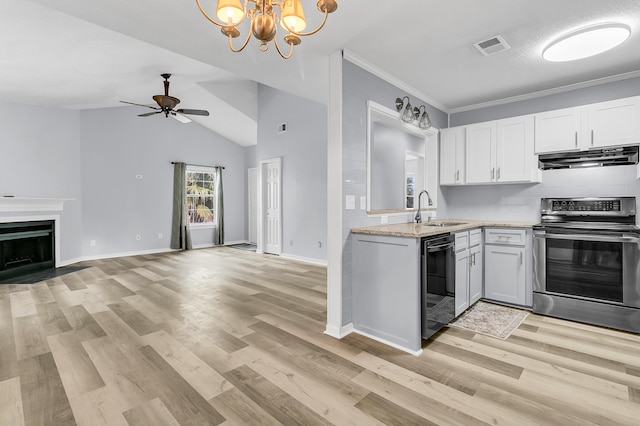 kitchen featuring white cabinetry, light hardwood / wood-style flooring, stainless steel stove, ceiling fan with notable chandelier, and ornamental molding