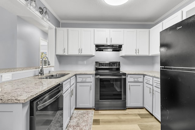 kitchen featuring black appliances, white cabinetry, and sink