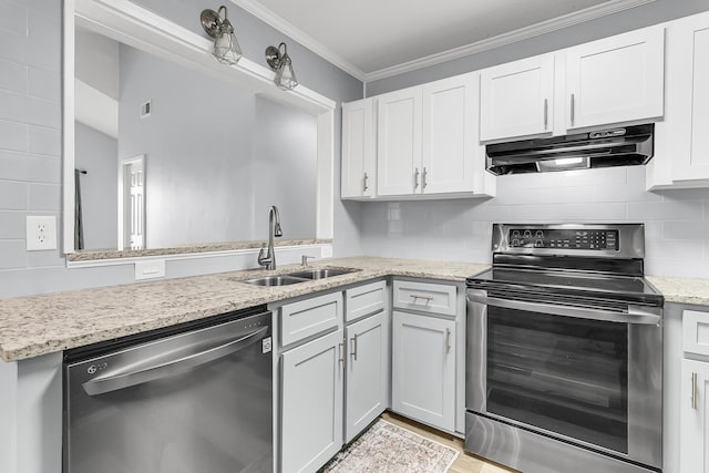 kitchen featuring sink, stainless steel appliances, tasteful backsplash, white cabinets, and ornamental molding