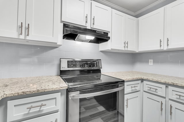 kitchen featuring stainless steel electric stove, light stone counters, white cabinets, and ornamental molding