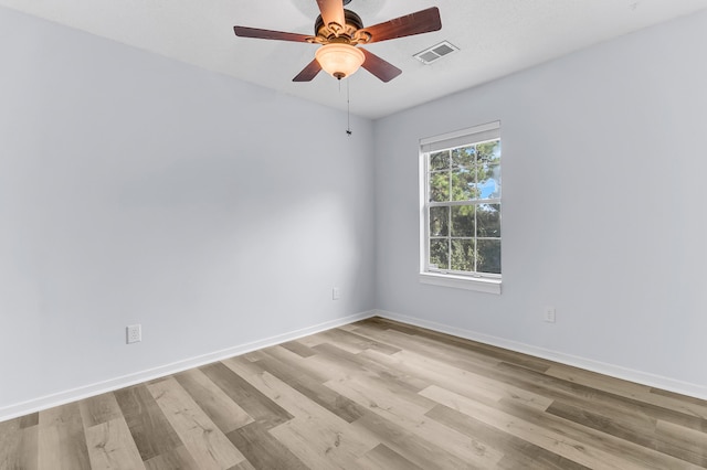 spare room with ceiling fan and light hardwood / wood-style floors