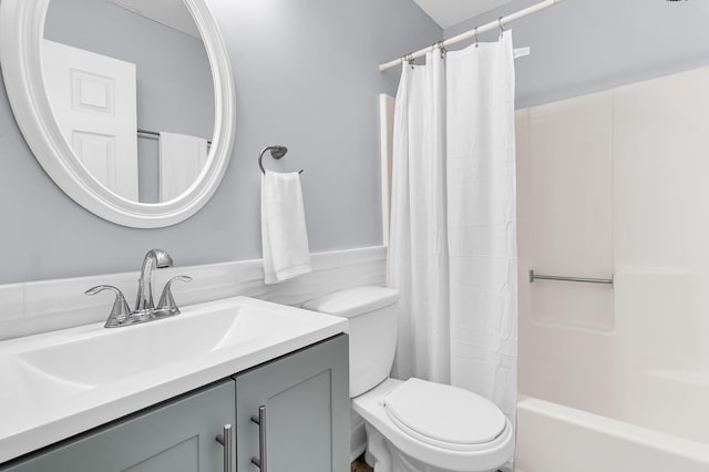 full bathroom with vanity, toilet, and shower / bathtub combination with curtain