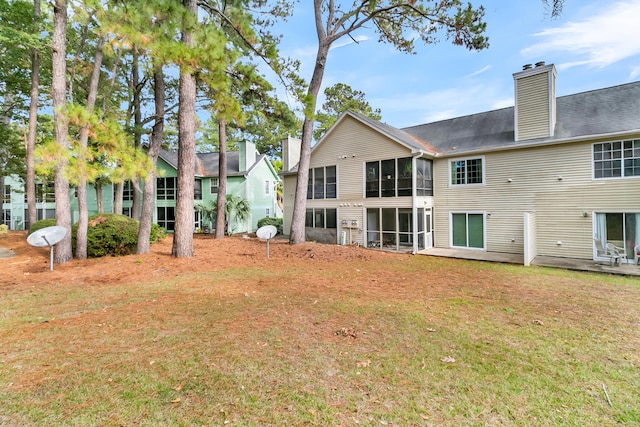 back of house with a yard