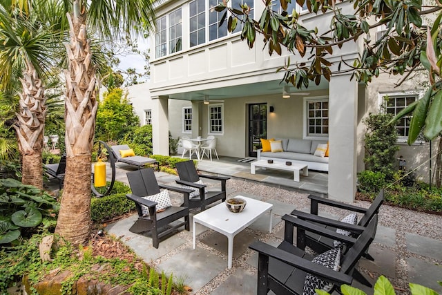 view of patio with an outdoor hangout area and a ceiling fan