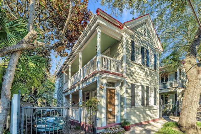 view of front of house with a balcony