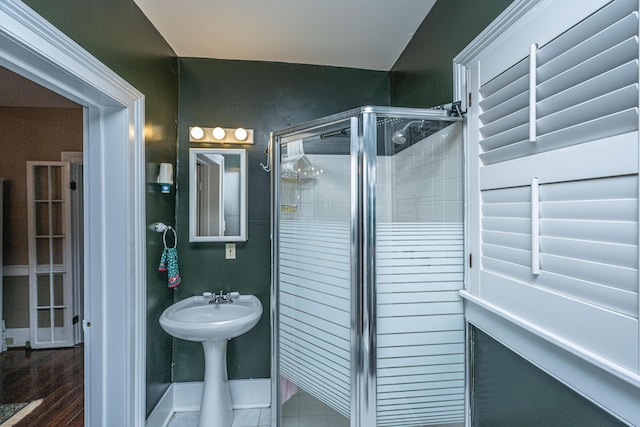 bathroom featuring an enclosed shower