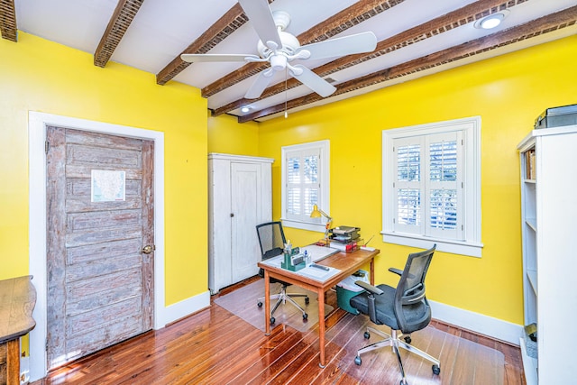 office space featuring beamed ceiling, ceiling fan, and wood-type flooring