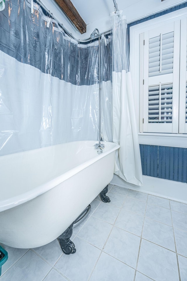 bathroom featuring tile patterned flooring and shower / tub combo