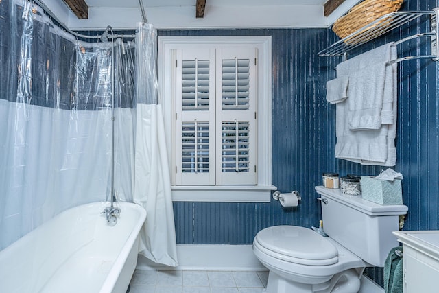 bathroom with tile patterned floors, toilet, and shower / bath combo