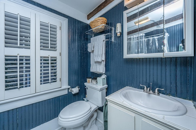 bathroom featuring vanity and toilet