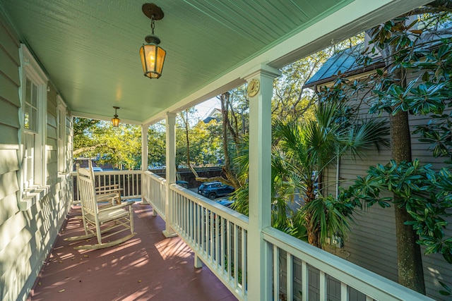 wooden terrace featuring a porch