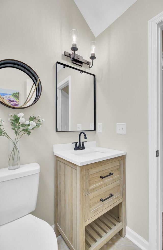 16 Oatly Cir, Charleston, SC 29414 - bathroom with toilet, vanity, baseboards, and vaulted ceiling