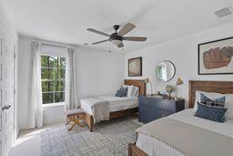 bedroom with visible vents and a ceiling fan