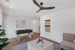 interior space featuring recessed lighting, ceiling fan, and wood finished floors