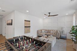 living room with a ceiling fan and recessed lighting