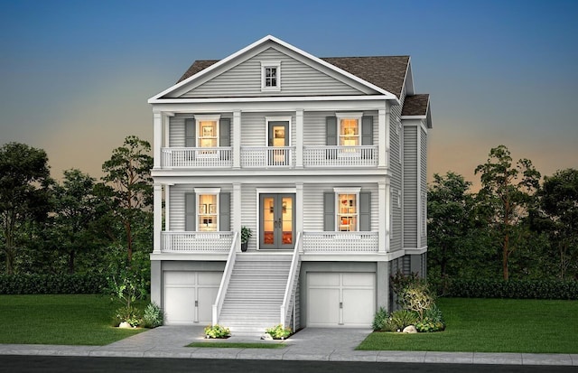 greek revival house featuring covered porch, french doors, a yard, and a balcony