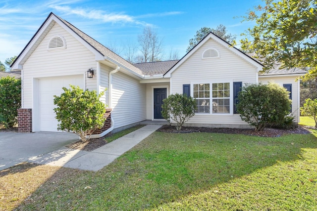 ranch-style house with a garage and a front lawn