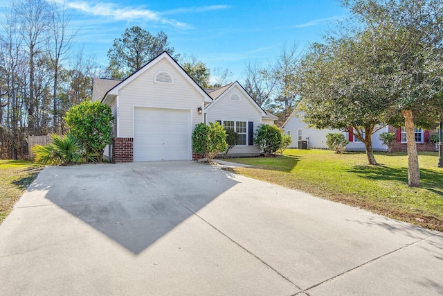 view of front of home with a garage and a front lawn