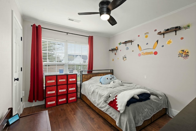 bedroom featuring crown molding, dark hardwood / wood-style floors, and ceiling fan