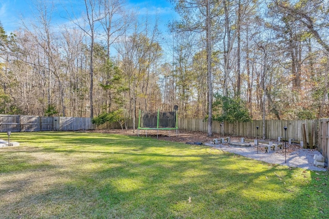 view of yard with a trampoline