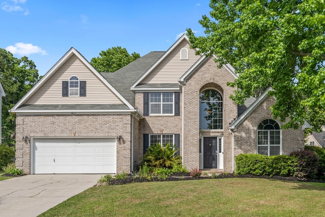 5413 Barnsley Dr, North Charleston, SC 29420 - traditional-style home featuring a front lawn, brick siding, and driveway