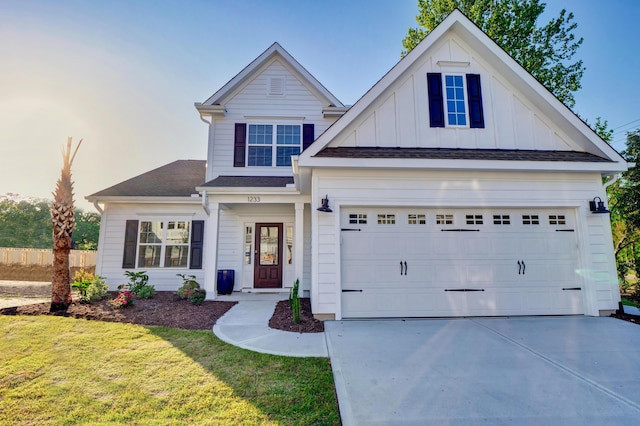 view of front facade with a front yard and a garage