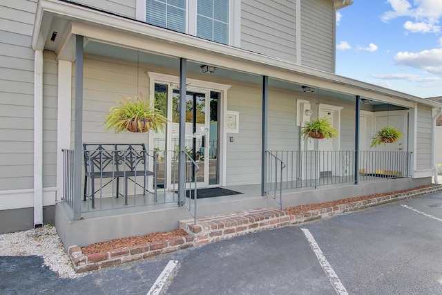 259 E Bay St Unit 7C, Charleston, SC 29401 - view of exterior entry featuring a porch and uncovered parking