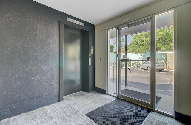 259 E Bay St Unit 7C, Charleston, SC 29401 - entryway featuring elevator and a textured wall