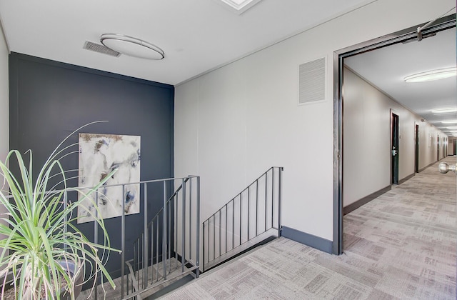 259 E Bay St Unit 7C, Charleston, SC 29401 - corridor featuring an upstairs landing, baseboards, and carpet