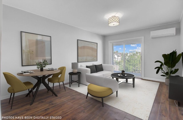 259 E Bay St Unit 7C, Charleston, SC 29401 - living area featuring an AC wall unit, dark wood-style floors, and baseboards