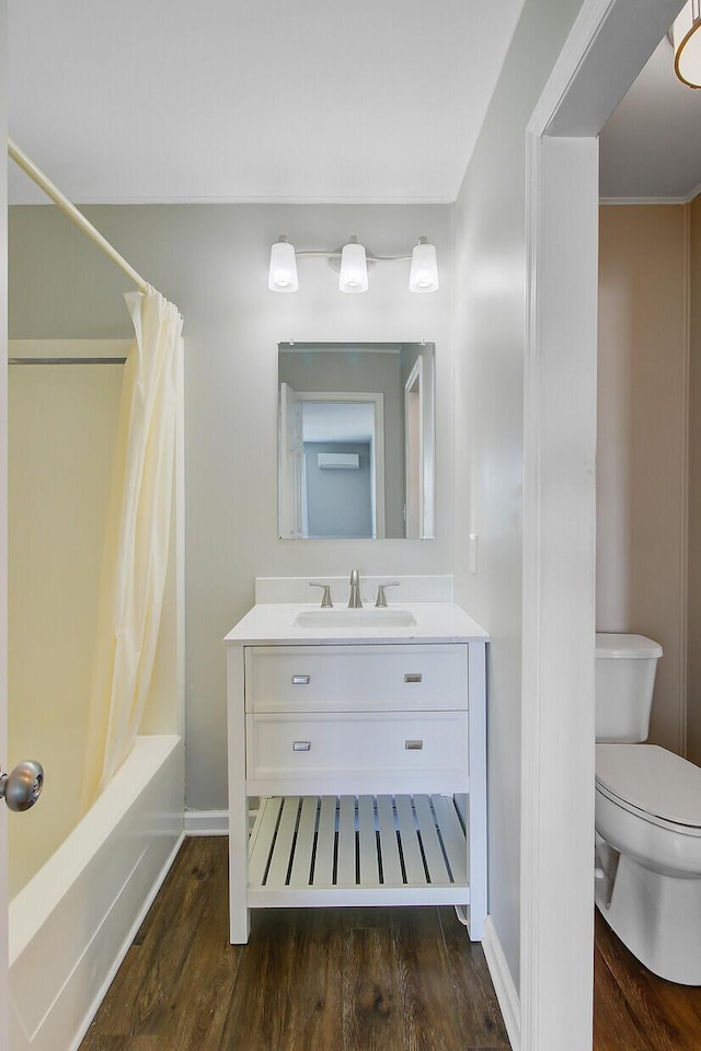 259 E Bay St Unit 7C, Charleston, SC 29401 - full bath with wood finished floors, toilet, vanity, baseboards, and shower / tub combo with curtain