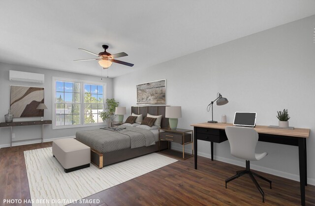 259 E Bay St Unit 7C, Charleston, SC 29401 - bedroom with a wall mounted air conditioner, an office area, wood finished floors, and baseboards