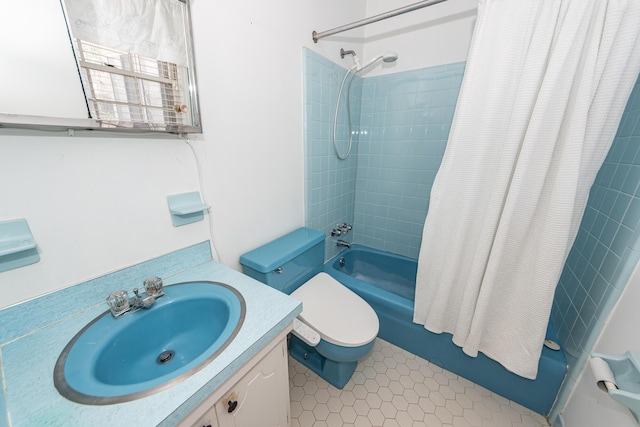 bathroom featuring toilet, shower / tub combo, tile patterned flooring, and vanity