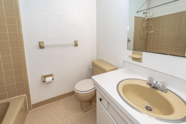 bathroom featuring bathtub / shower combination, tile patterned flooring, toilet, vanity, and baseboards