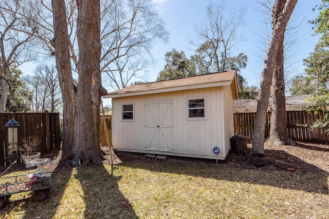 view of shed featuring a fenced backyard