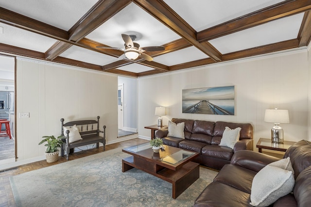 living room featuring coffered ceiling, visible vents, beamed ceiling, and ceiling fan