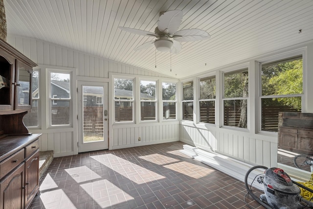 unfurnished sunroom featuring lofted ceiling and ceiling fan