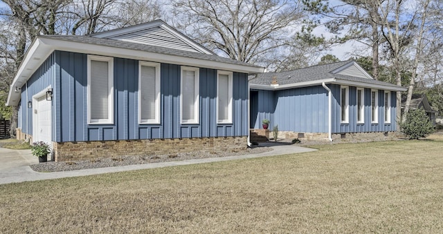 exterior space featuring a shingled roof, board and batten siding, crawl space, a garage, and a front lawn