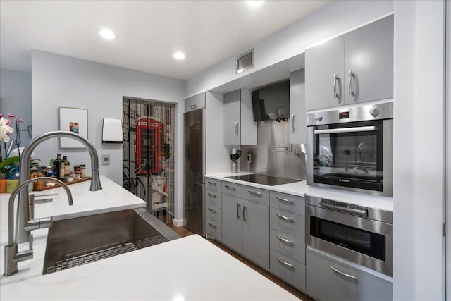 1481 Center Street Ext Unit 1102, Mount Pleasant, SC 29464 - kitchen featuring stainless steel appliances, gray cabinets, light countertops, recessed lighting, and extractor fan