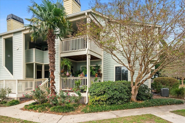1481 Center Street Ext Unit 1102, Mount Pleasant, SC 29464 - view of property exterior with a chimney and covered porch