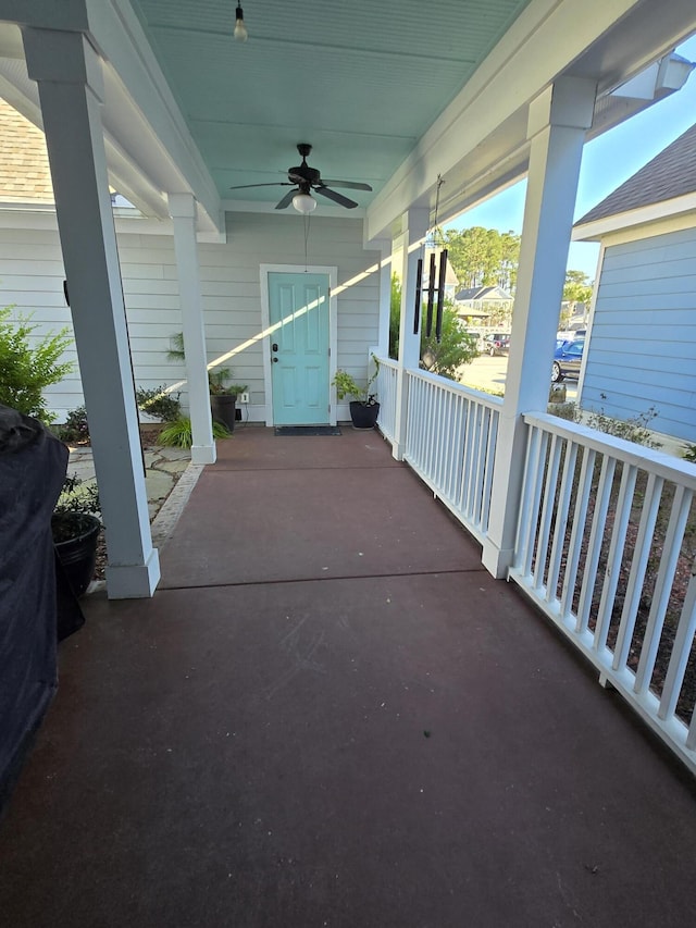 view of patio with ceiling fan and a porch