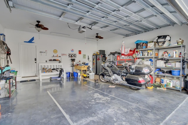 garage with a garage door opener, a workshop area, and a ceiling fan